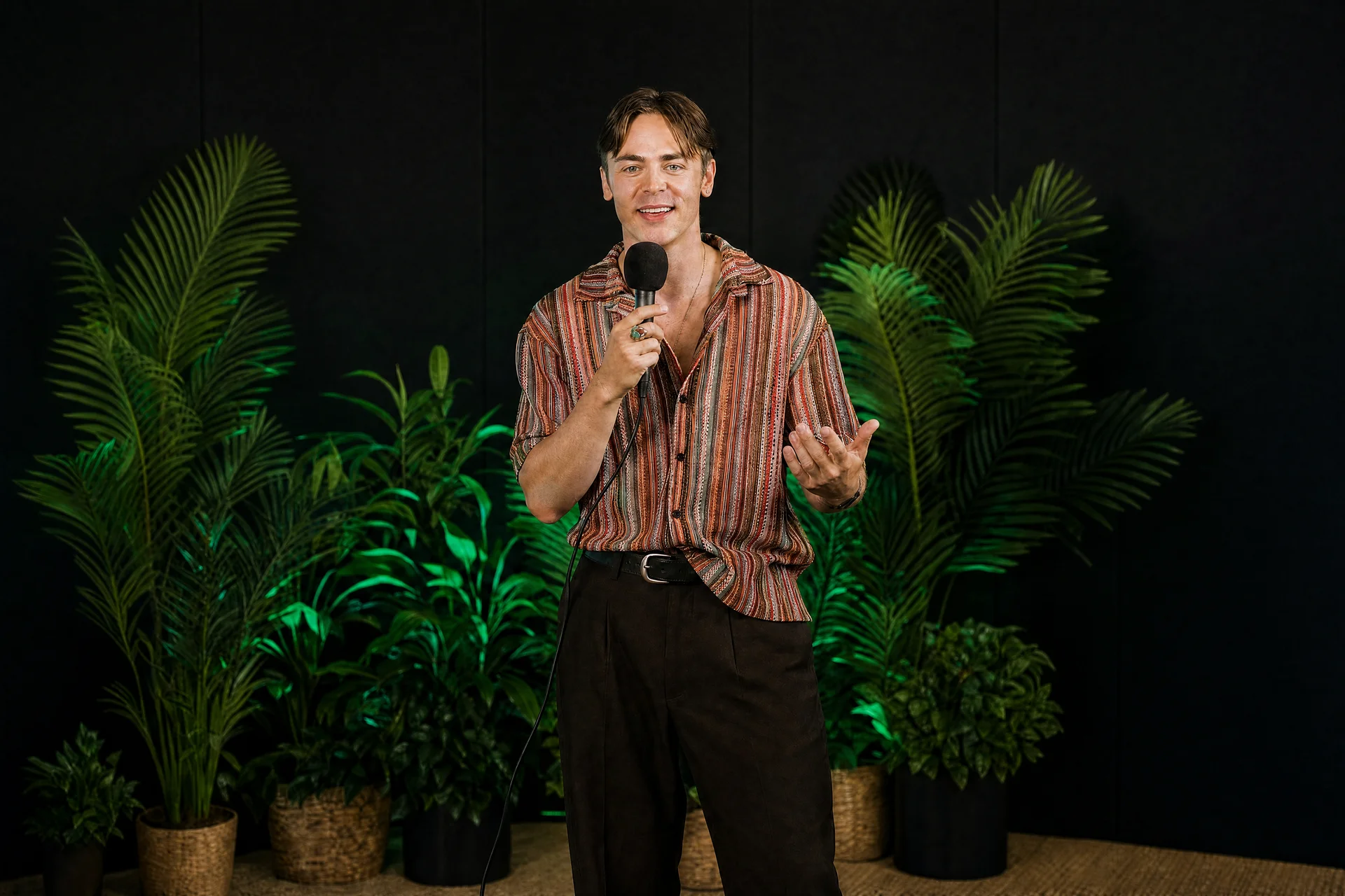 Brandon DesJarlais speaking on stage with a microphone